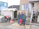 Eliot Waldman, Adamie Ooloosie Ashevak and their granddaughter at Nuna Parr's house
